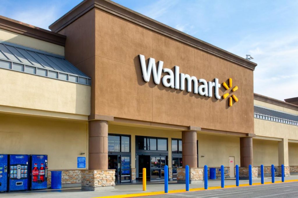 A front of one of the Walmart stores, in brick and in typical colors.