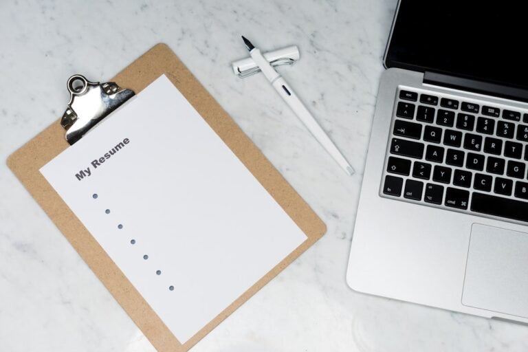 Blank first resume on a clipboard beside a laptop, ready for a teen learning how to make a resume for your first job