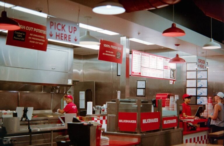 Jobs that hire at 16: teenage crew members working the counter of a fast food restaurant