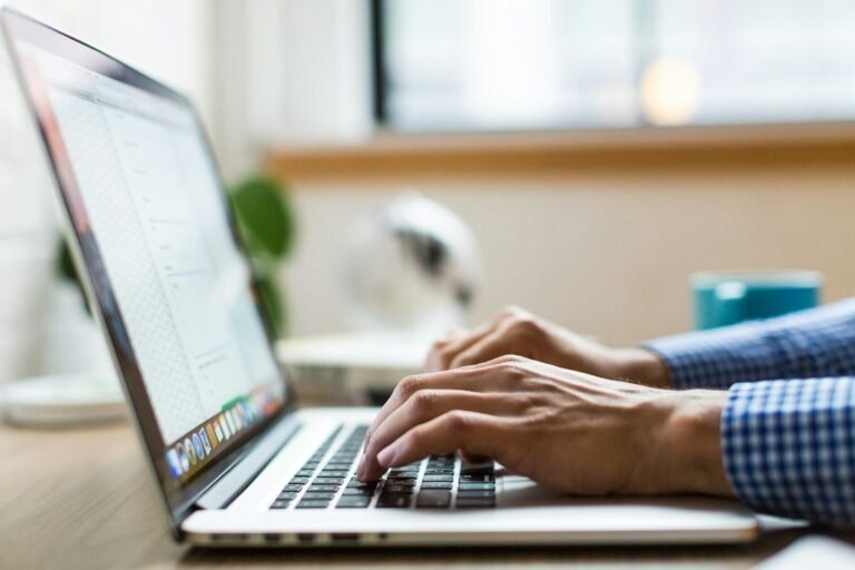 Applicant working through an Amazon assessment test on a laptop before the interview stage