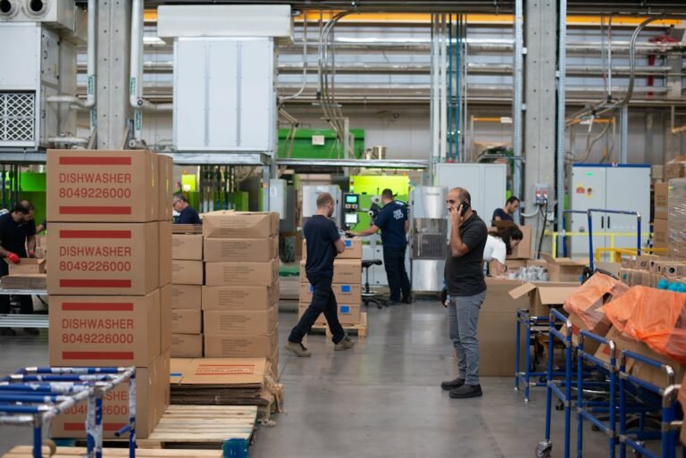 Warehouse workers moving cardboard boxes, the daily grind behind FedEx package handler pay