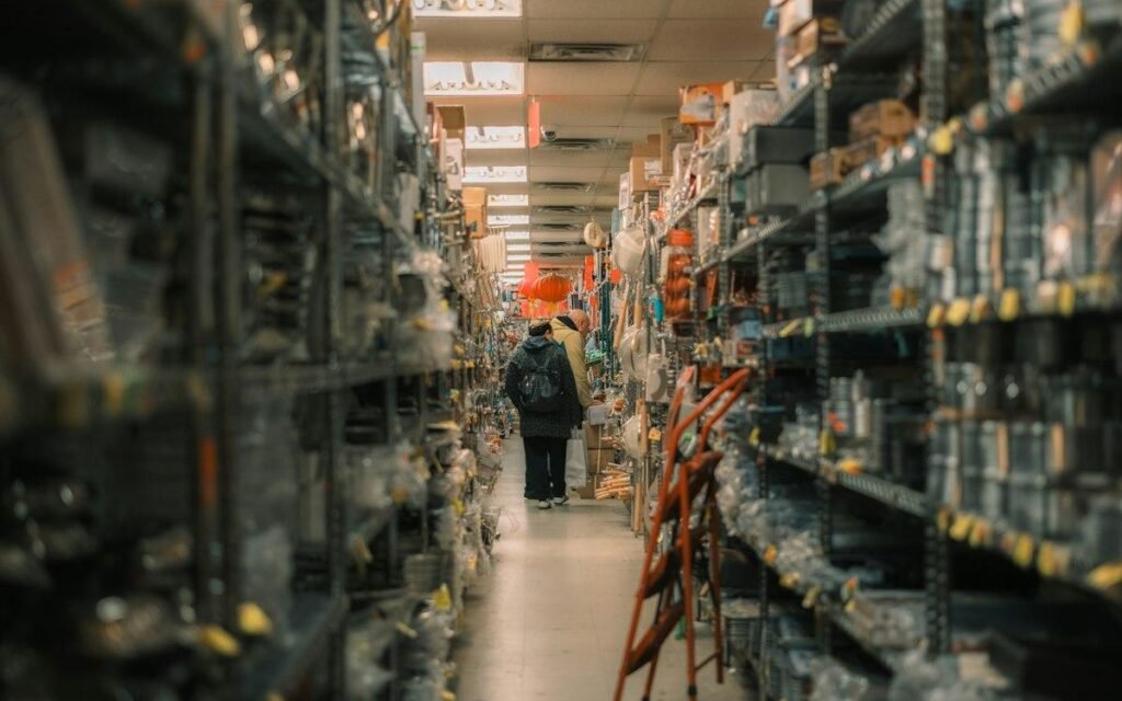 Customers in a hardware store aisle, the setting the Home Depot assessment test asks you to picture