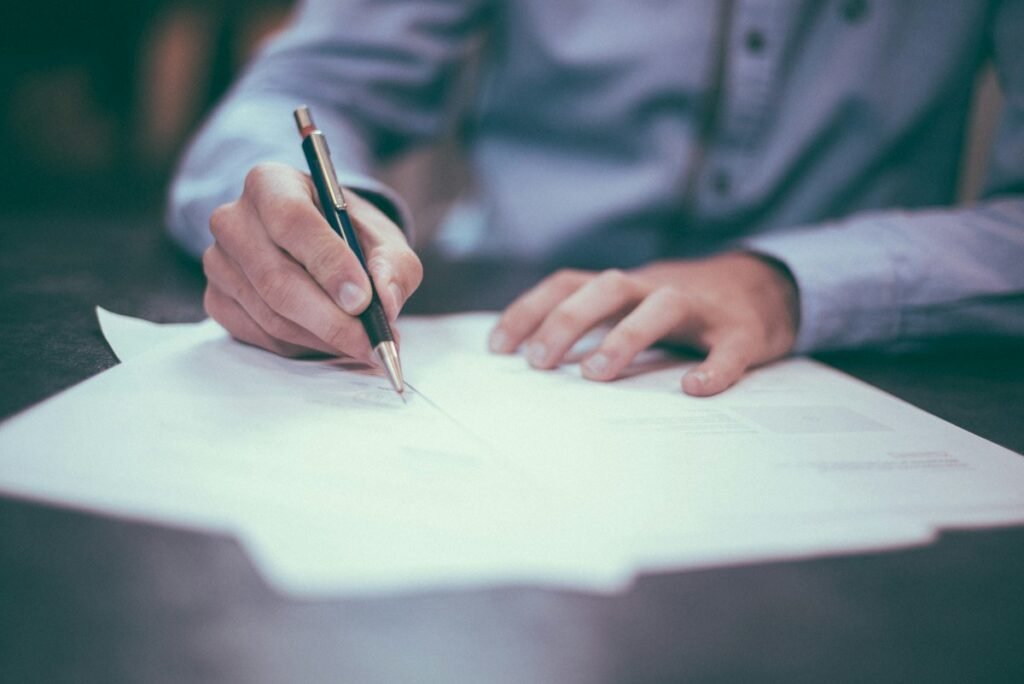 Applicant signing consent forms for a Walmart background check after a job offer