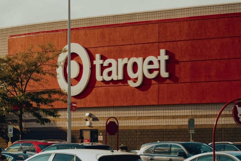 Target employee benefits guide cover showing a red Target store facade with the bullseye logo above a full parking lot